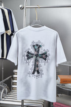 White short-sleeve T-shirt with large back cross graphic in black, green, and teal
