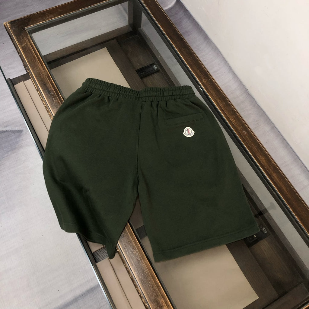 Stone Island dark green shorts with elastic waistband and small front logo patch