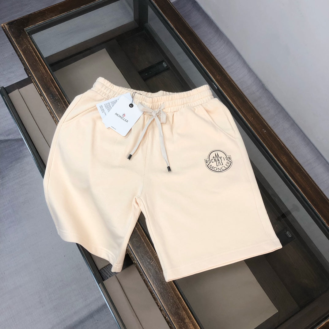 Cream drawstring shorts with front embroidered logo