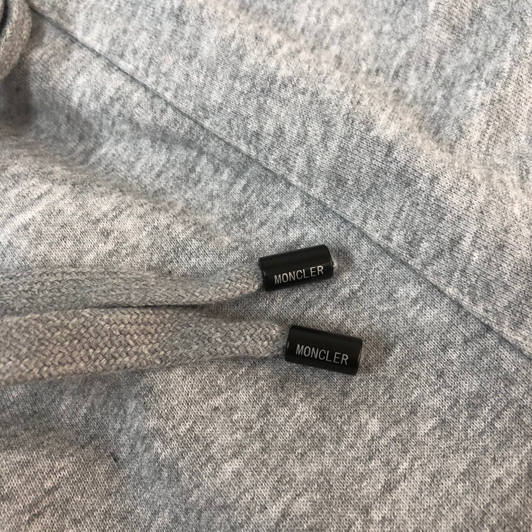 Heather gray shorts with black waistband tabs labeled Moncler