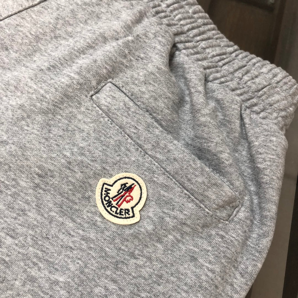 Heather gray shorts with logo patch and angled side pocket