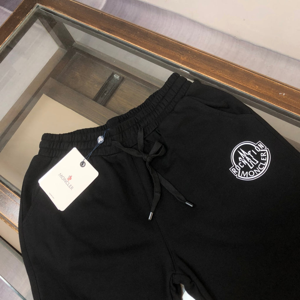 Stone Island shorts, black elastic waist with front drawstring and logo patch
