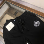 Stone Island shorts, black elastic waist with front drawstring and logo patch