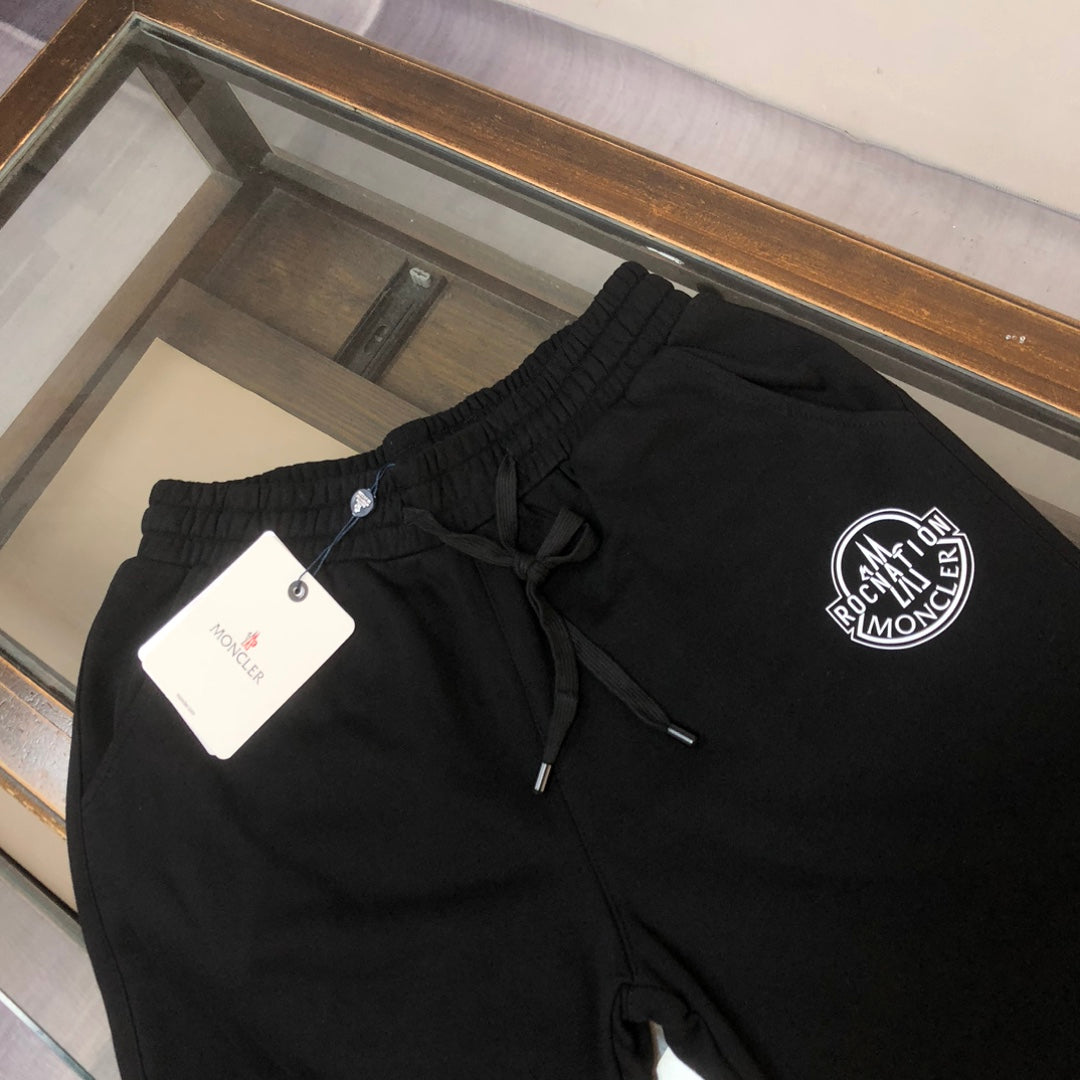 Stone Island shorts, black elastic waist with front drawstring and logo patch