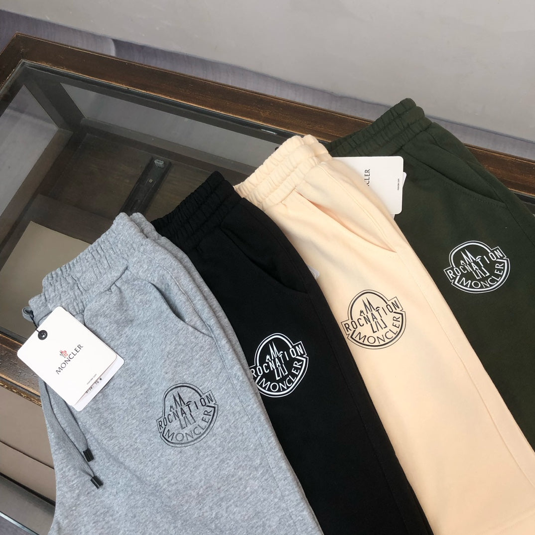 Stone Island shorts display: gray, black, and cream drawstring shorts with circular logos