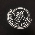Stone Island logo patch on black fabric
