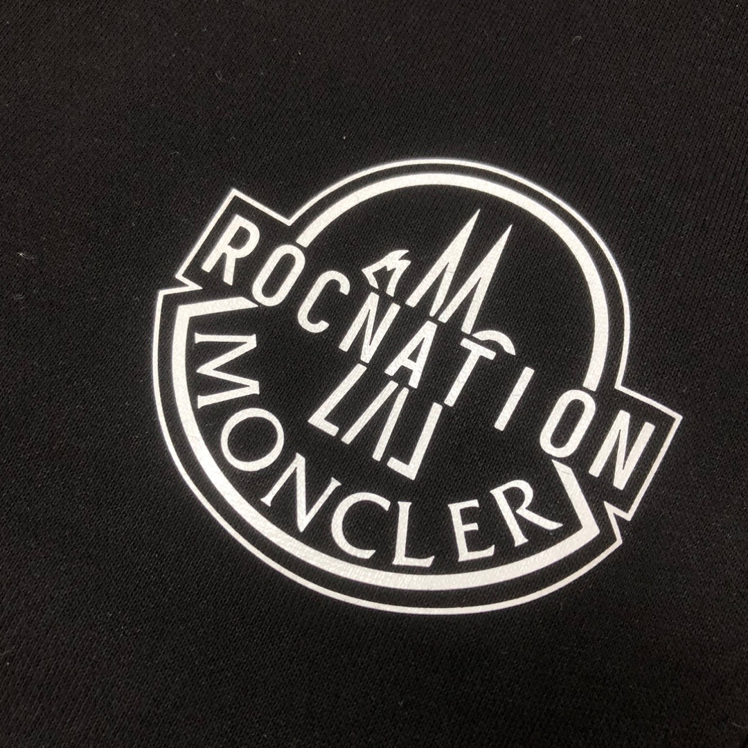 Stone Island logo patch on black fabric