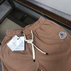 Stone Island drawstring shorts in light tan with elastic waist and logo patch detail