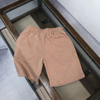 Stone Island back view drawstring shorts in light tan with elastic waistband