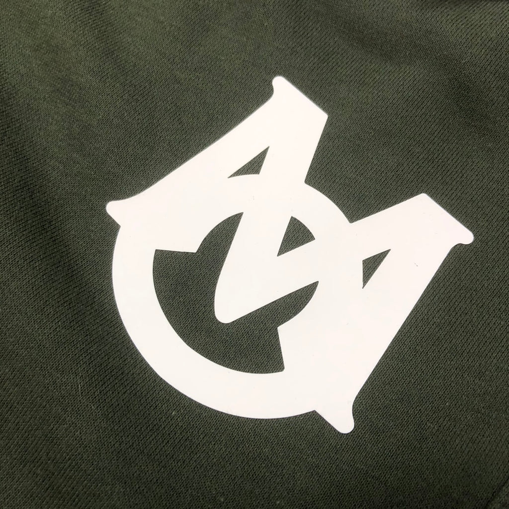 Dark green shorts with large white logo graphic on front