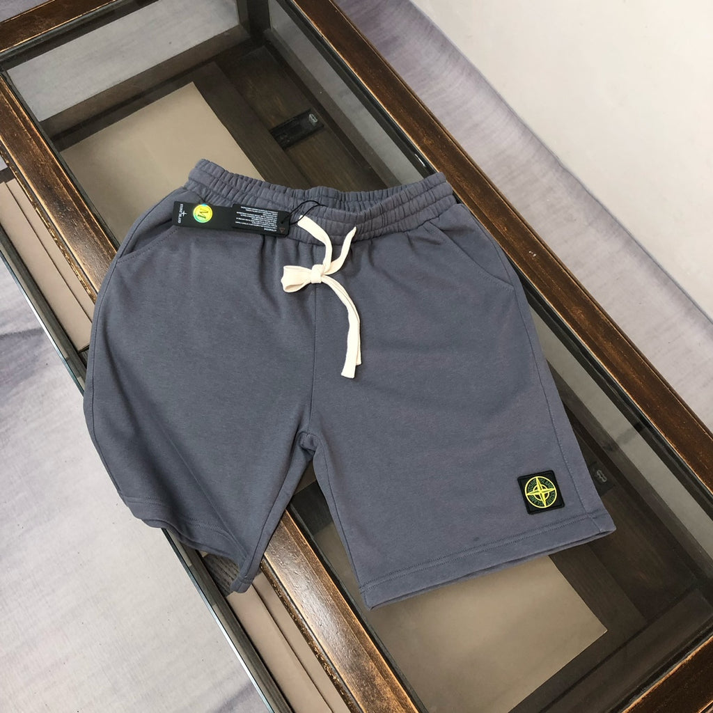 Gray drawstring shorts with elastic waistband and Stone Island logo patch