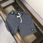Gray drawstring shorts with elastic waistband and Stone Island logo patch