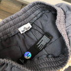 Gray shorts with inner waistband label and care tags