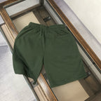 Stone Island dark green shorts with elastic waistband, shown from the back