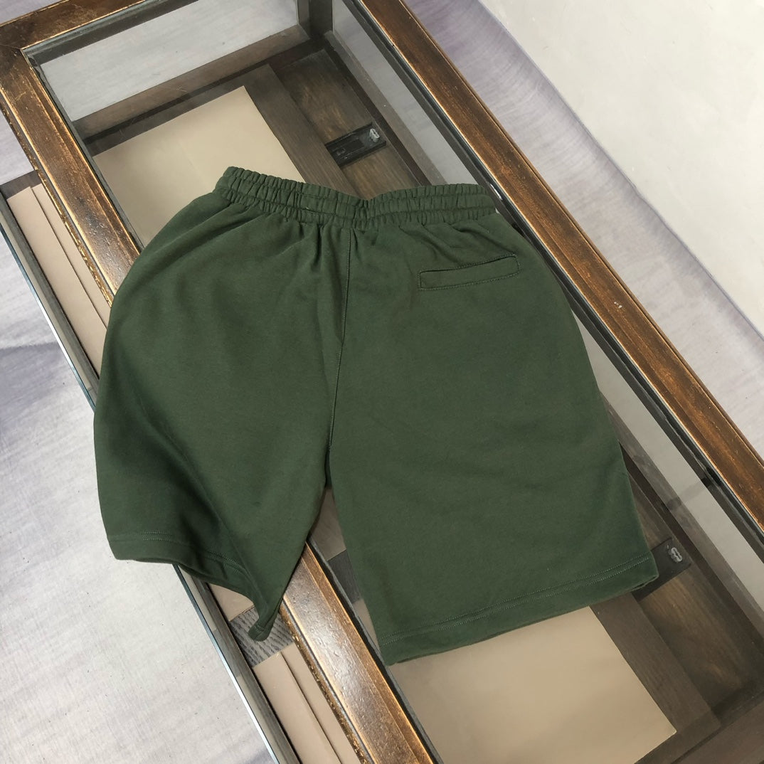 Stone Island dark green shorts with elastic waistband, shown from the back