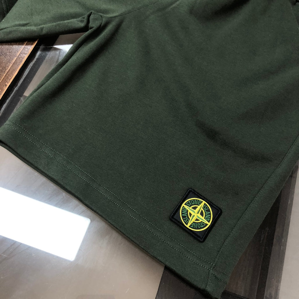 Stone Island dark green shorts with stitched hem and circular logo patch