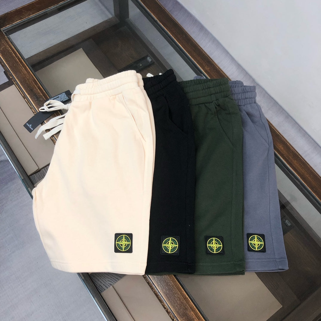 Stone Island shorts set: white, black, dark green, and blue with circular logo patch