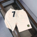 Cream drawstring shorts with elastic waistband and Stone Island logo patch