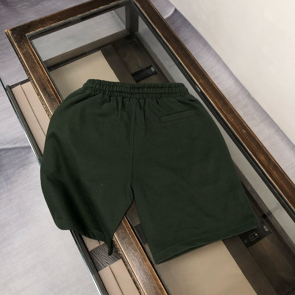 Stone Island green shorts with elastic waist and side pocket opening