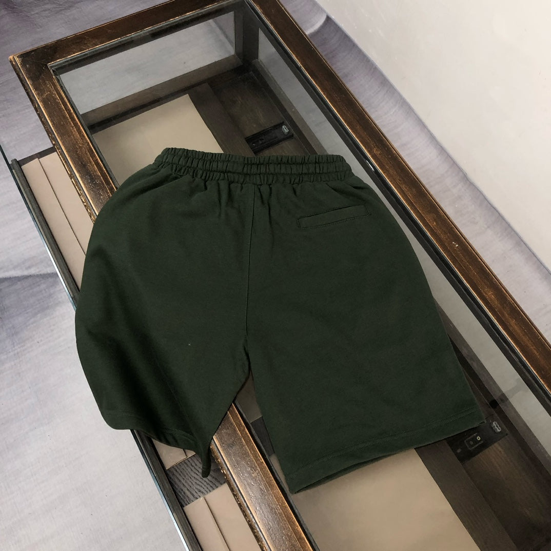 Stone Island green shorts with elastic waist and side pocket opening