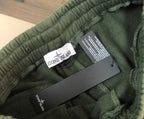 Stone Island green shorts waistband with brand tag and size label