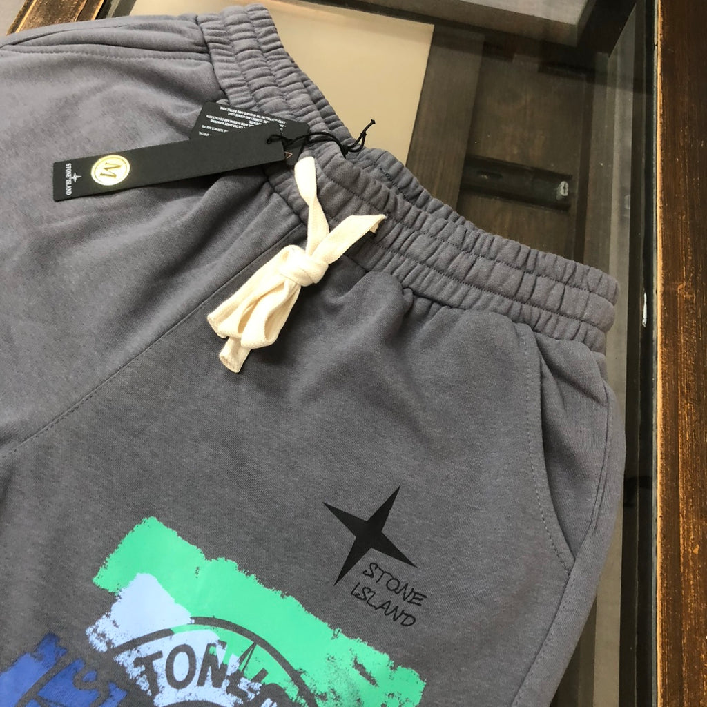 Stone Island grey shorts with elastic waistband, white drawstring, star and graphic