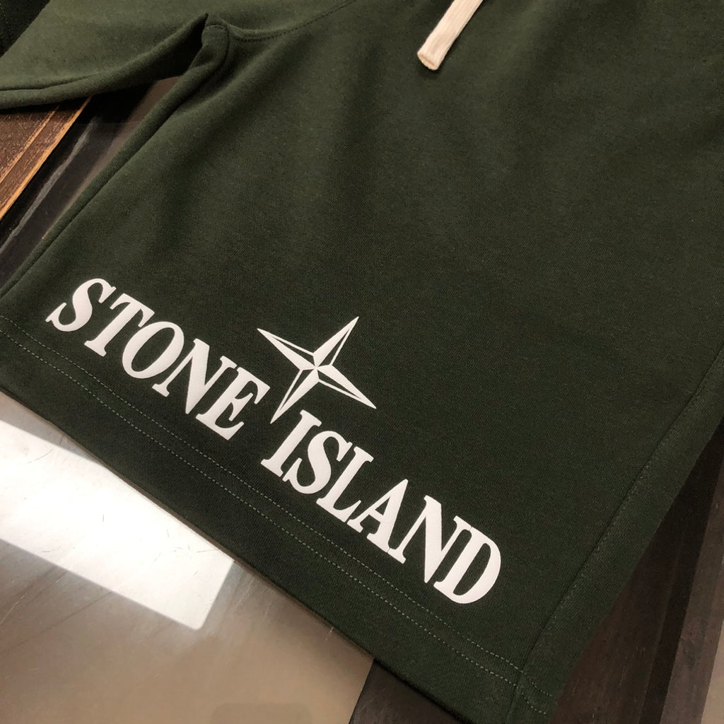 Dark green Stone Island shorts with large STAR and logo lettering
