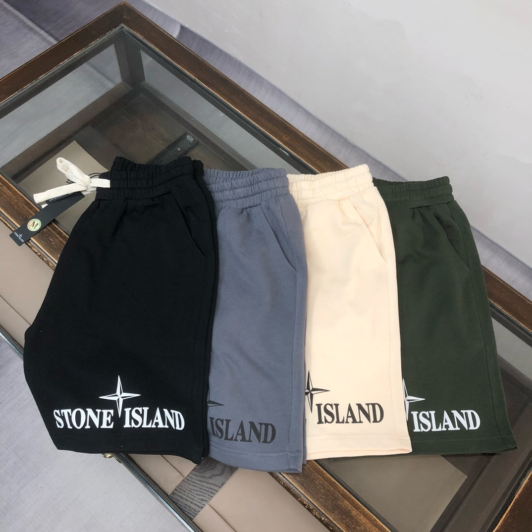 Stone Island drawstring shorts set in black, blue, cream, and green