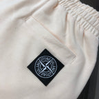 Stone Island off-white shorts with stitched square emblem patch