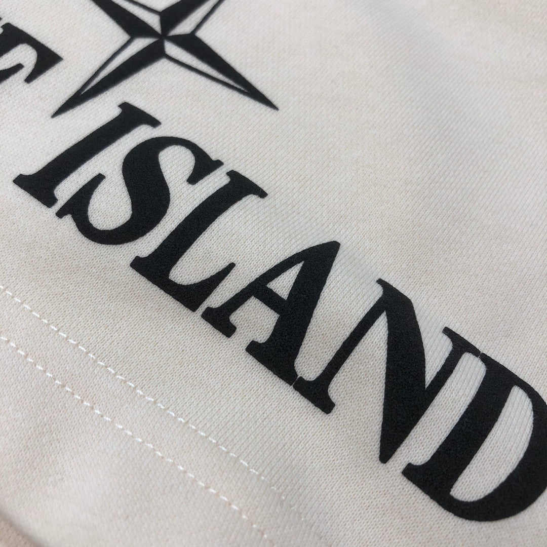 Stone Island logo print detail on off-white shorts