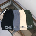 Stone Island logo shorts in black, blue, off-white, and dark green