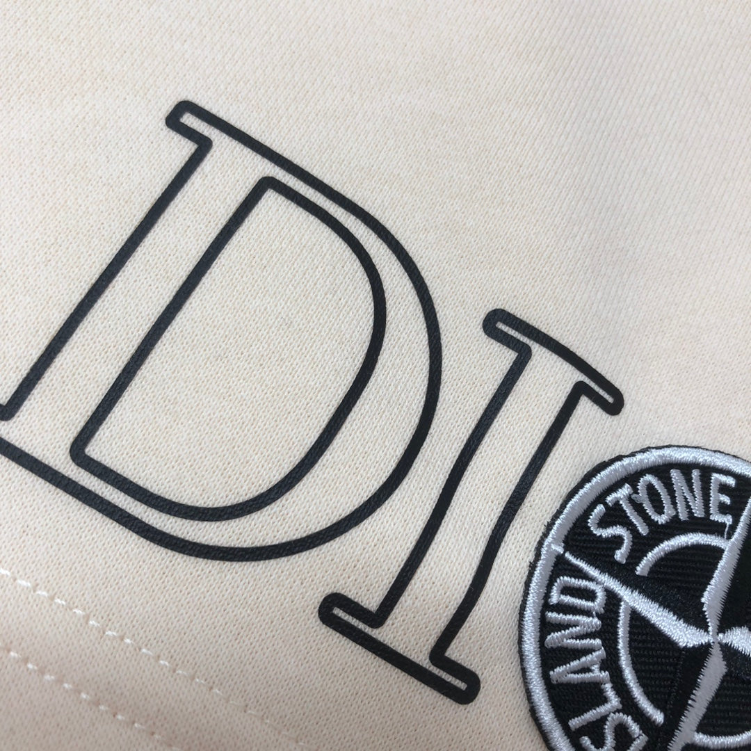 Stone Island off-white shorts close-up of Dior logo print
