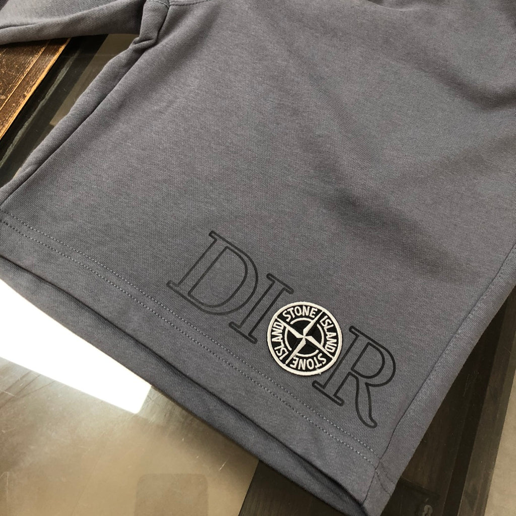 Gray drawstring shorts with embroidered logo badge and logo lettering on hem