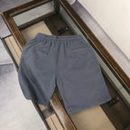 Dark gray drawstring shorts with elastic waistband and simple front design