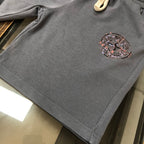 Dark gray Stone Island shorts with small logo patch on the lower left leg