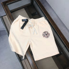Cream Stone Island logo shorts with drawstring waist and side pocket openings