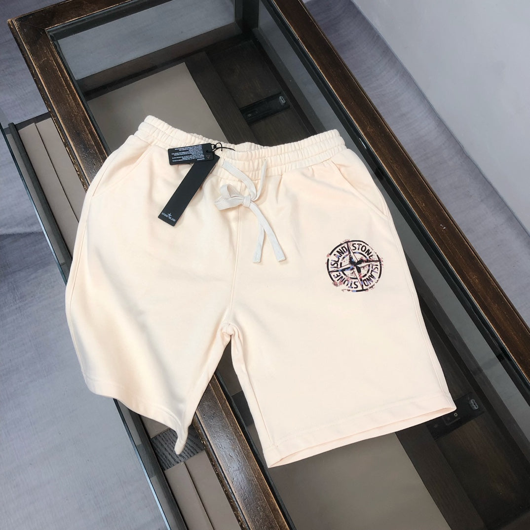 Cream Stone Island logo shorts with drawstring waist and side pocket openings