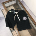 Stone Island black shorts with white drawstring and circular logo patch