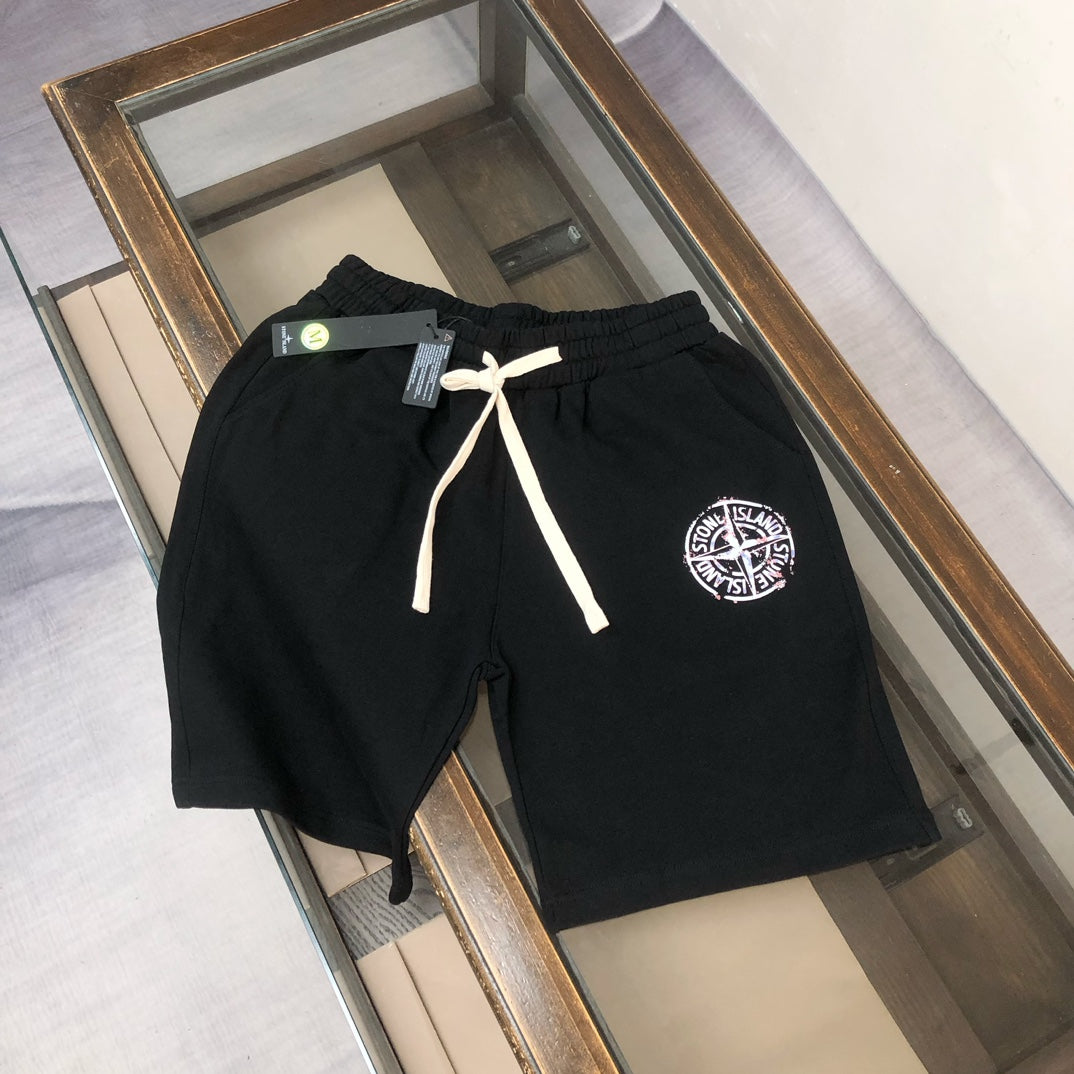 Stone Island black shorts with white drawstring and circular logo patch