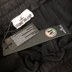 Stone Island black shorts with care label and size tag inside waistband