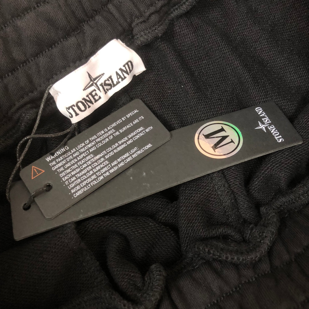 Stone Island black shorts with care label and size tag inside waistband