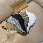 Assorted Gucci caps: white, black, and brown GG monogram designs with curved brims