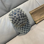 GG-pattern baseball cap in blue with a top button and curved brim