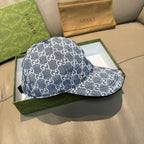 Gucci cap in dark blue with repeating GG monogram pattern, brim and side panel on box