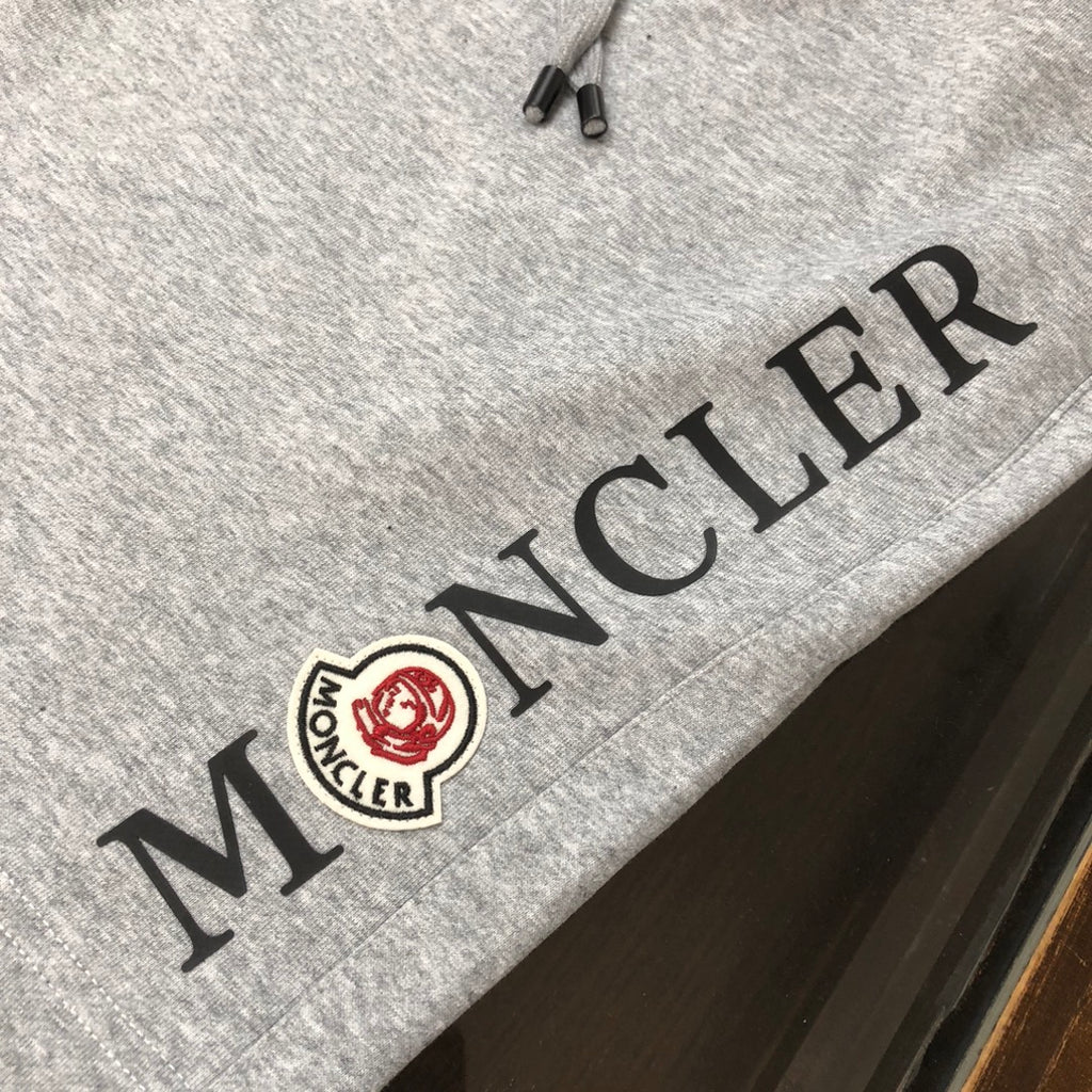 Stone Island shorts, light gray with black embroidered side text and logo patch