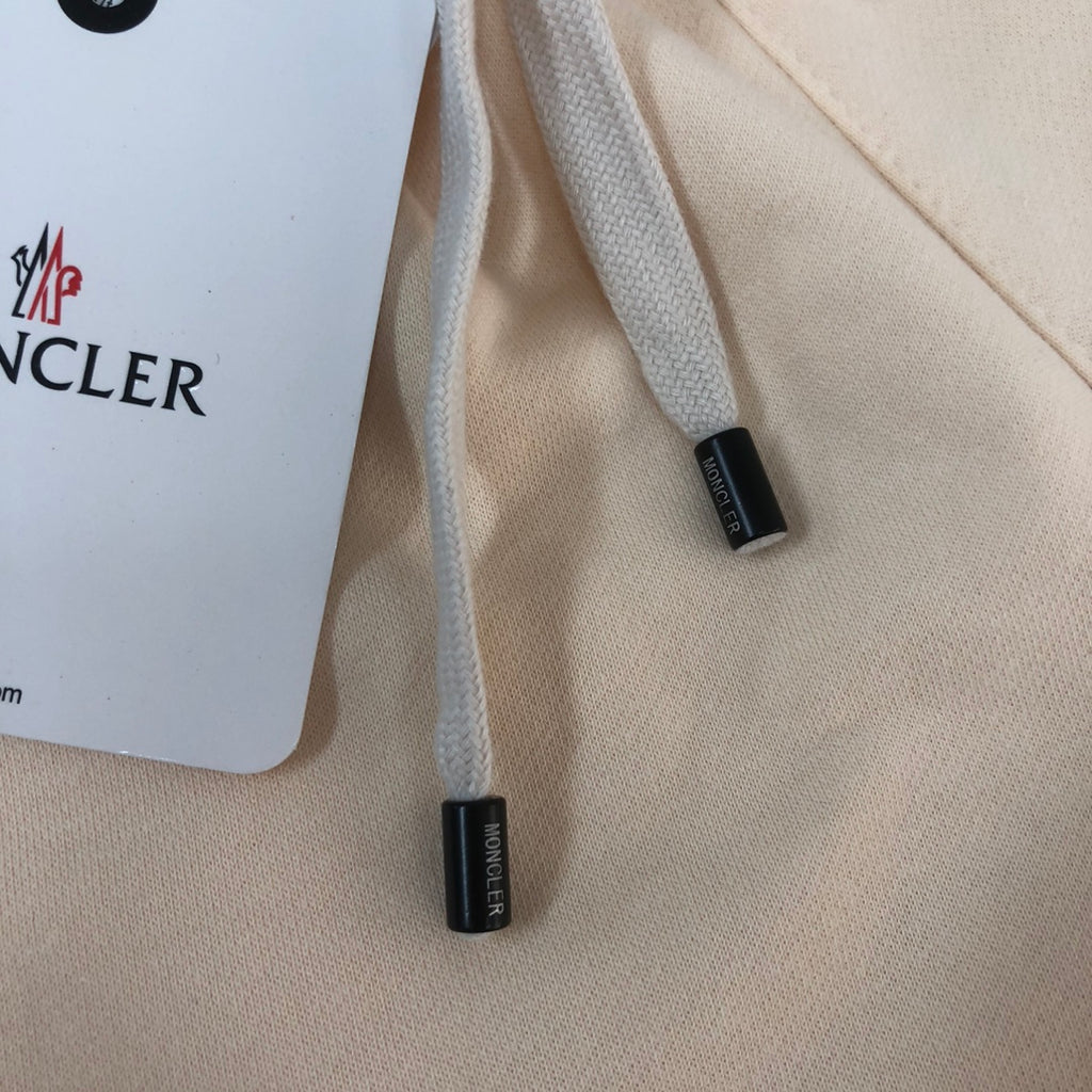 Stone Island cream shorts drawstring ends with Moncler tag labels