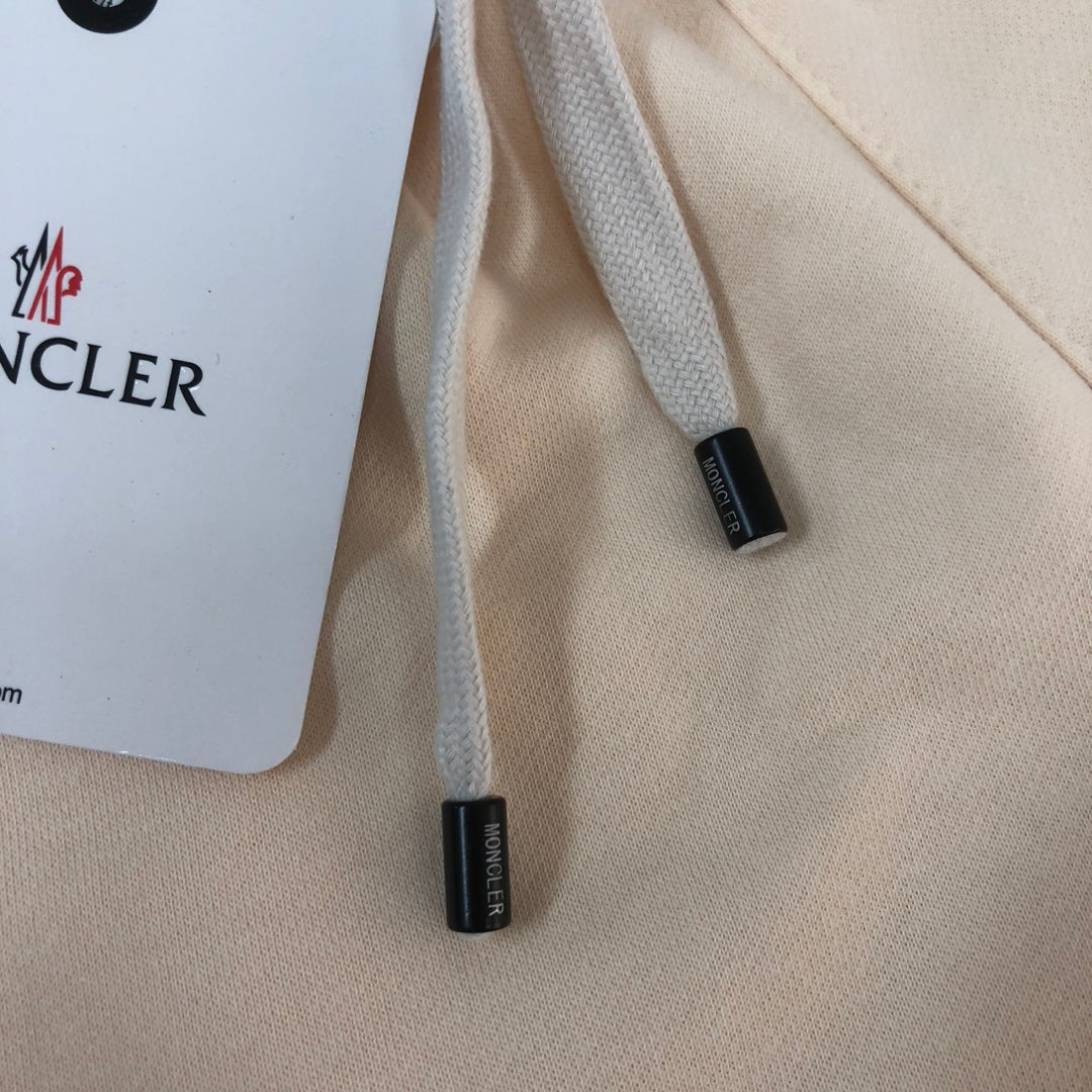 Stone Island cream shorts drawstring ends with Moncler tag labels