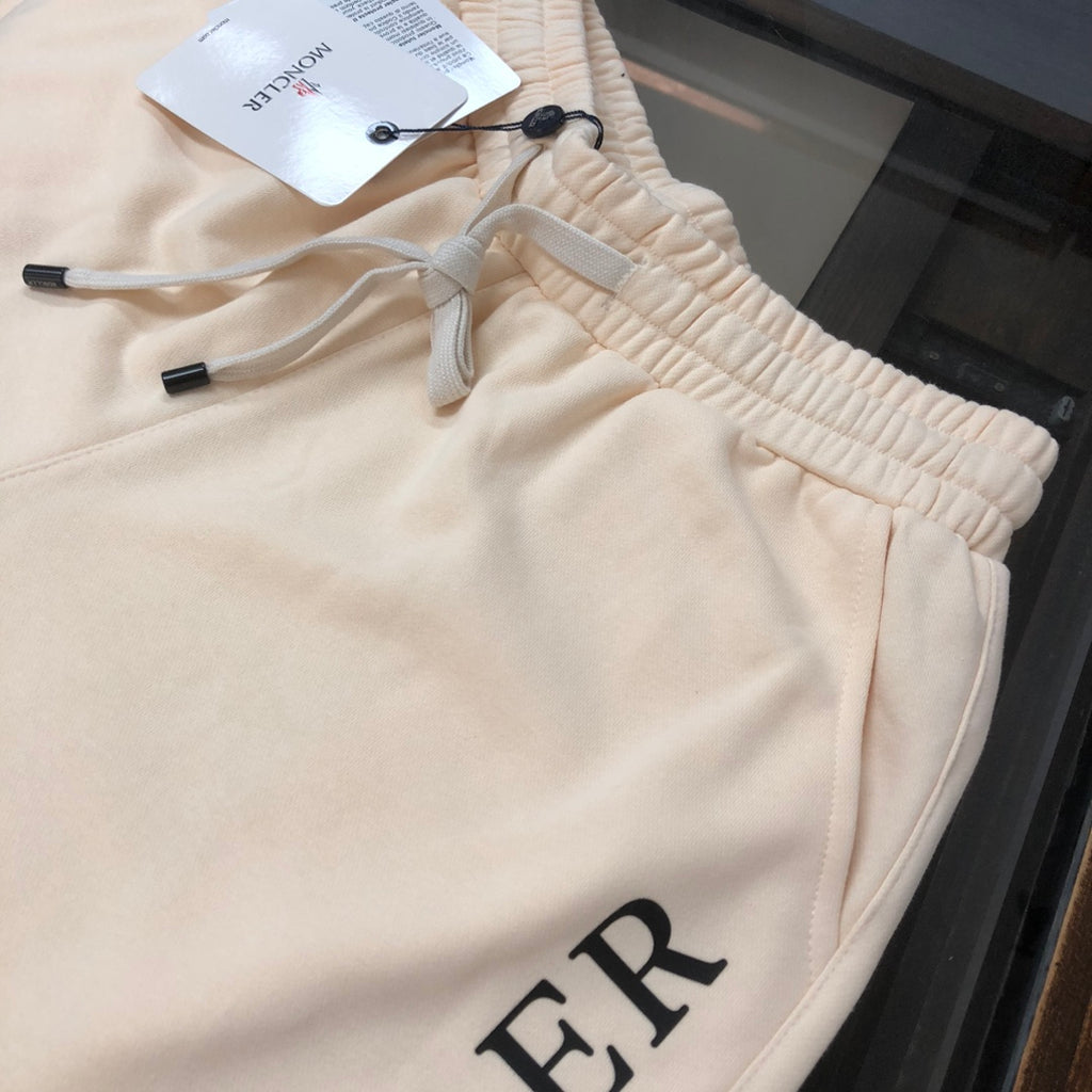 Stone Island cream shorts with elastic waistband and drawstring, close-up
