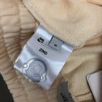 Stone Island cream shorts fabric with ZIND label and size tag on waistband