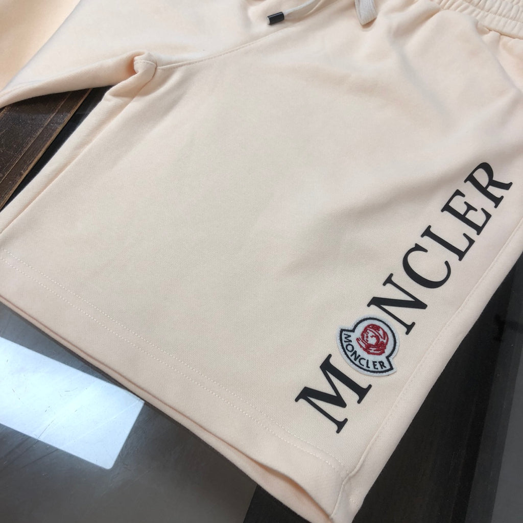 Stone Island cream shorts with side Moncler logo lettering